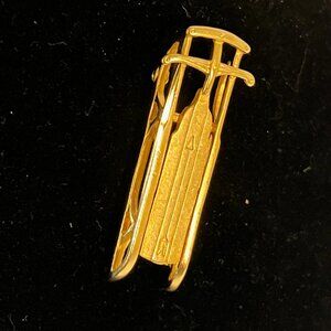 Vintage gold tone brooch, sled pin